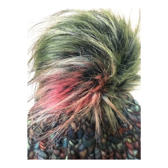 Hand knit variegated knit hat with faux fur pom